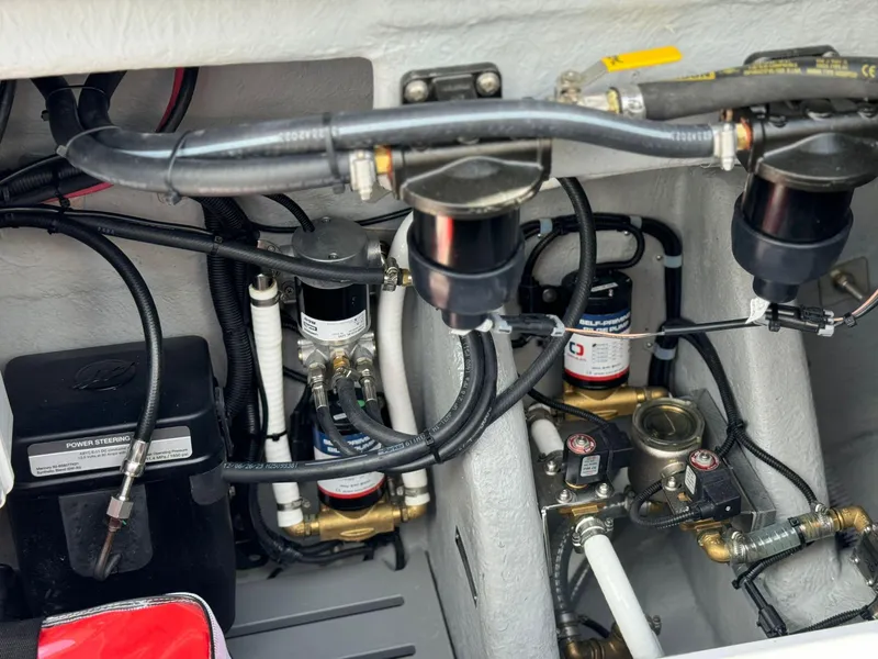 Slide: The Image of Engine compartment of 2025 Ranieri CAYMAN 38.0 EXECUTIVE with visible wiring and components. - 47