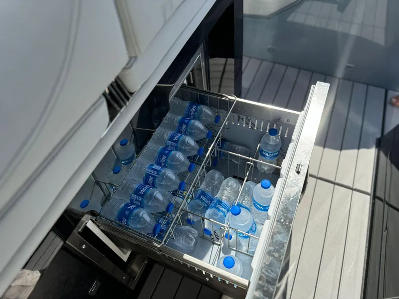 Slide: The Image of Open drawer fridge with water bottles on Ranieri CAYMAN 38.0 EXECUTIVE, 2025 model. - 48