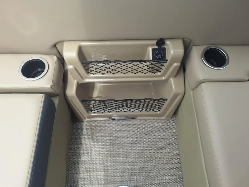 Slide: The Image of 2024 Starcraft EX 22 Weekender interior with cup holders and storage compartments. - 12