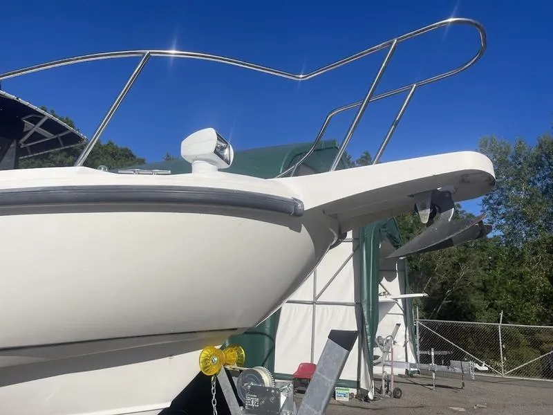 Slide: The Image of Boston Whaler 260 Outrage 2000 boat bow with anchor, parked outdoors. - 12