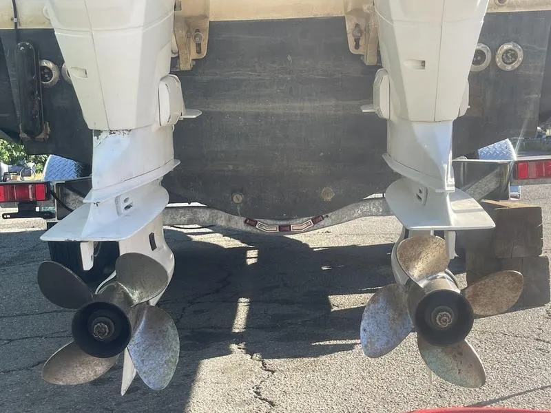 Slide: The Image of Twin outboard motors on a 2000 Boston Whaler 260 Outrage boat. - 13