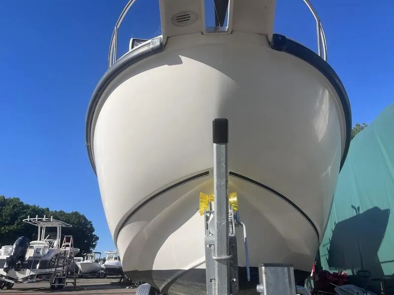 Slide: The Image of 2000 Boston Whaler 260 Outrage boat on trailer, viewed from front. - 14