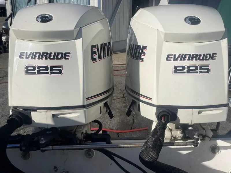 Slide: The Image of Twin Evinrude 225 outboard motors on a 2000 Boston Whaler 260 Outrage boat. - 15