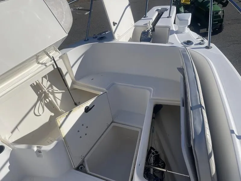 Slide: The Image of 2000 Boston Whaler 260 Outrage boat interior with open storage compartments. - 3