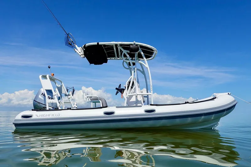 Slide: The Image of 2026 Highfield Patrol 540 boat on a lake. - 1