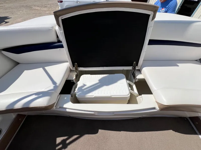 Slide: The Image of 2008 Four Winns H200 boat with open storage compartment and cooler. - 18