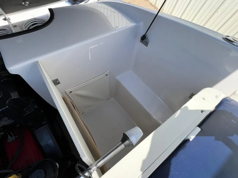 Slide: The Image of Open storage compartment in a 2008 Four Winns H200 boat. - 20
