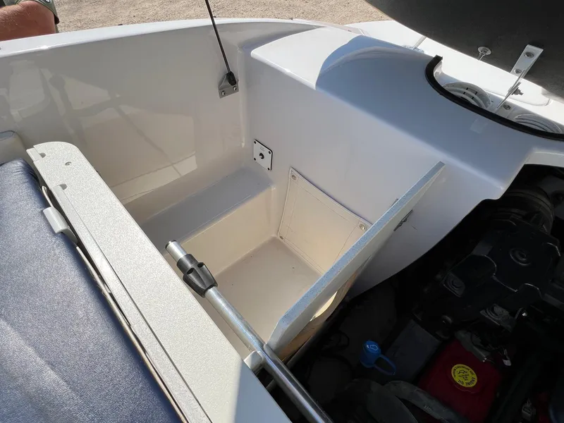 Slide: The Image of 2008 Four Winns H200 boat storage compartment and engine bay. - 21