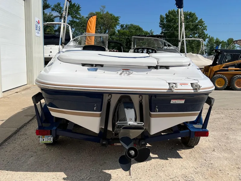 Slide: The Image of 2008 Four Winns H200 boat on trailer, rear view, parked outdoors. - 3