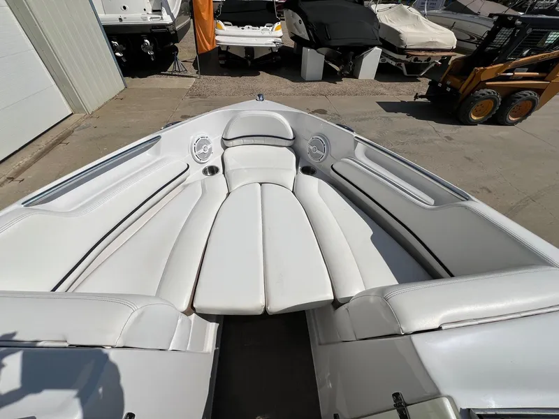Slide: The Image of 2008 Four Winns H200 boat interior with white seating and cup holders. - 6