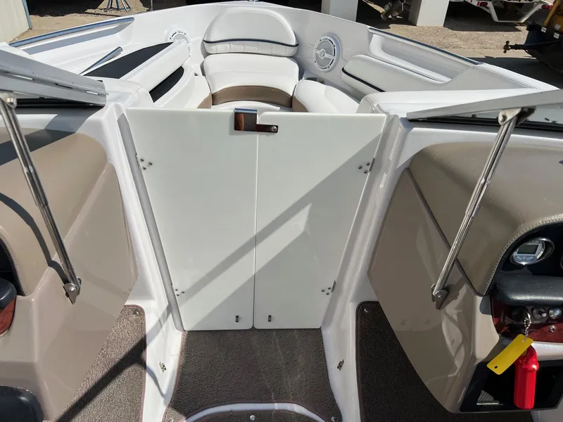 Slide: The Image of 2008 Four Winns H200 boat interior with seating and storage compartments. - 8