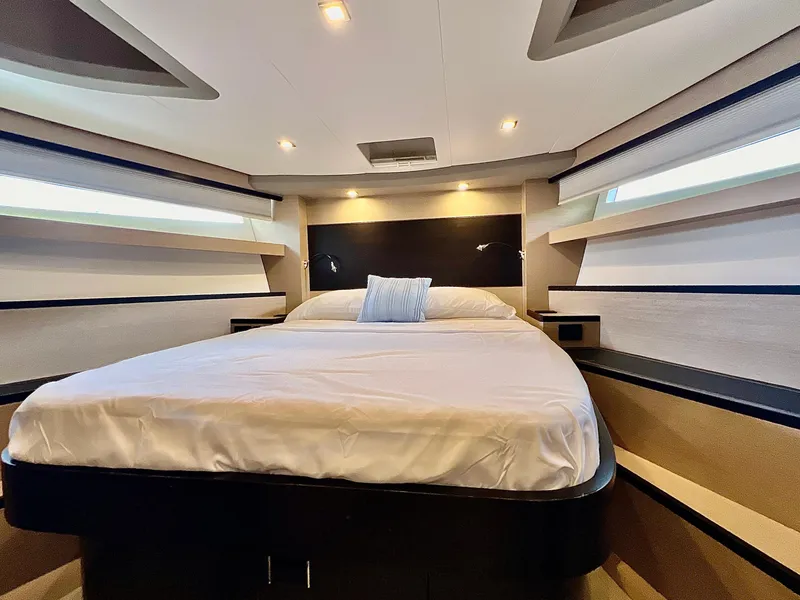 Slide: The Image of Luxurious bedroom interior of 2022 OKEAN Flybridge 50 yacht with modern lighting. - 22