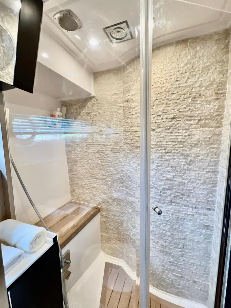 Slide: The Image of Modern shower area in the 2022 OKEAN Flybridge 50 yacht. - 29