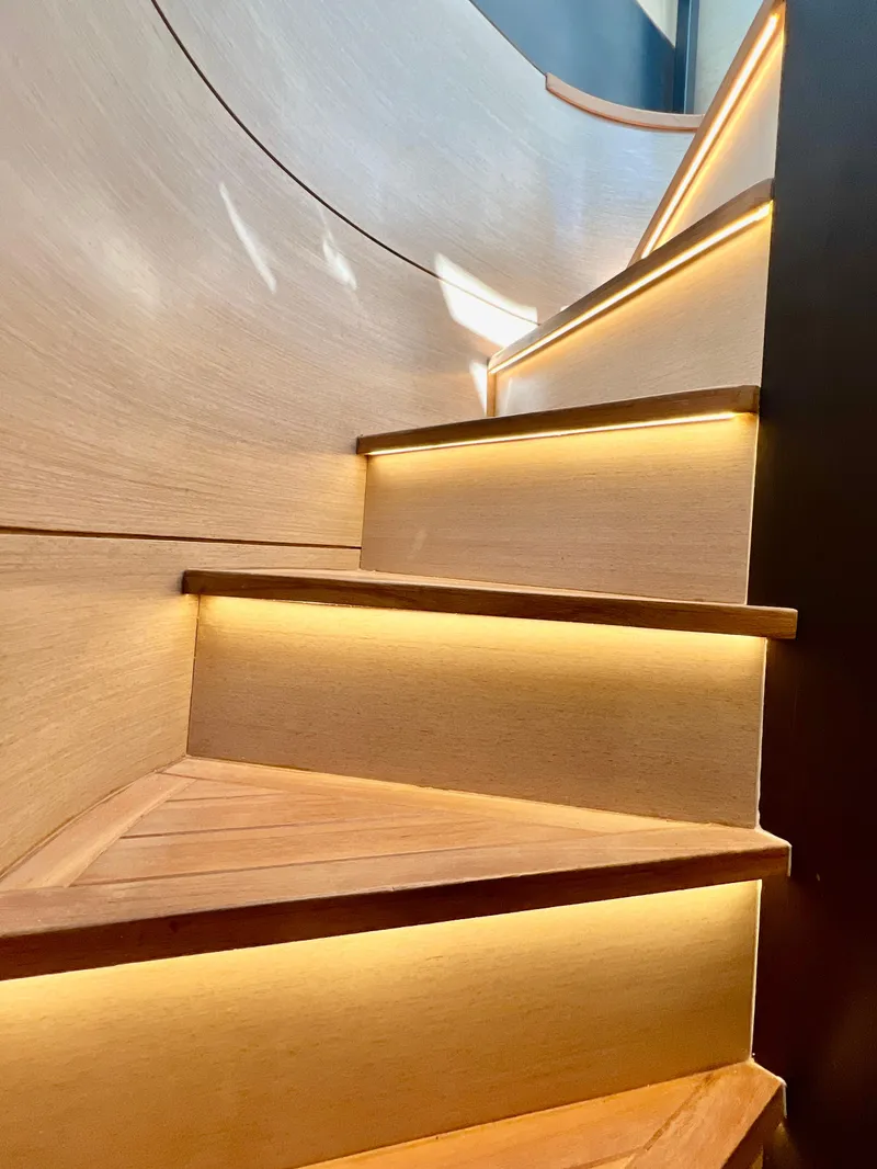 Slide: The Image of Modern staircase with ambient lighting on the 2022 OKEAN Flybridge 50 yacht. - 33