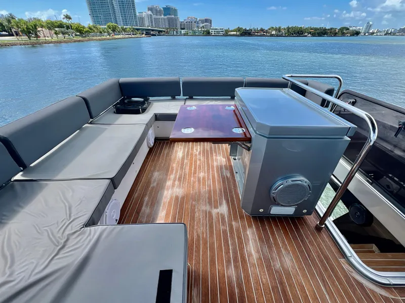 Slide: The Image of Flybridge seating area on 2022 OKEAN Flybridge 50 yacht with waterfront view. - 37