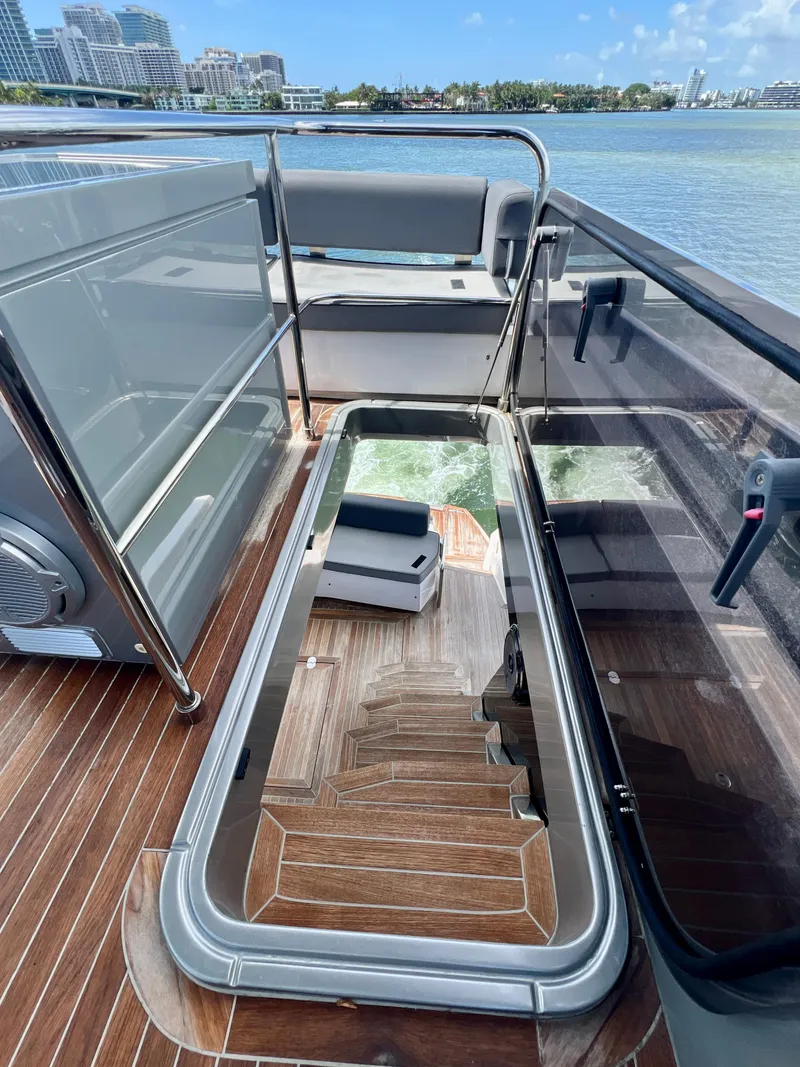 Slide: The Image of 2022 OKEAN Flybridge 50 yacht with open hatch and wooden stairs. - 41