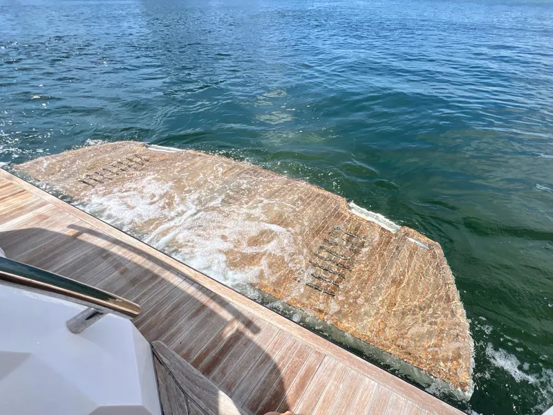 Slide: The Image of OKEAN Flybridge 50 2022 yacht's swim platform in water. - 47