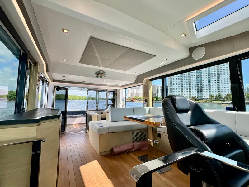 Slide: The Image of Luxurious interior of 2022 OKEAN Flybridge 50 yacht with modern furnishings and panoramic windows. - 5