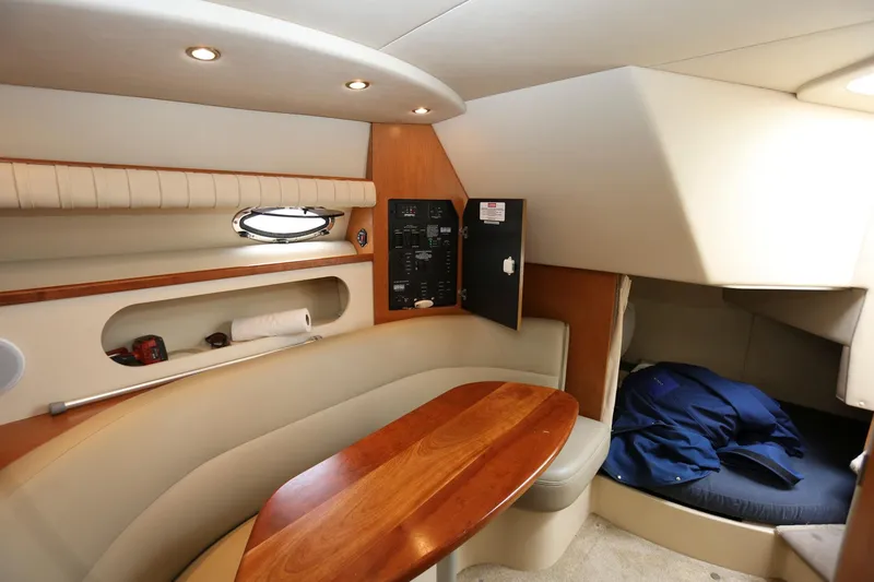 Slide: The Image of Interior cabin of 2005 Cruisers Yachts 280 CXi Express with seating and table. - 18