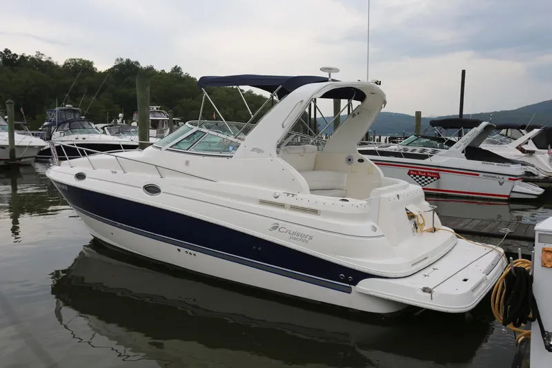 Slide: The Image of 2005 Cruisers Yachts 280 CXi Express docked at a marina. - 3