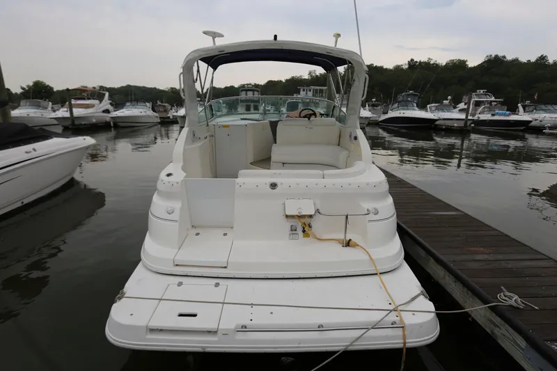 Slide: The Image of 2005 Cruisers Yachts 280 CXi Express docked at a marina. - 5