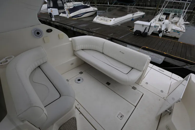 Slide: The Image of 2005 Cruisers Yachts 280 CXi Express interior seating area at dock. - 7