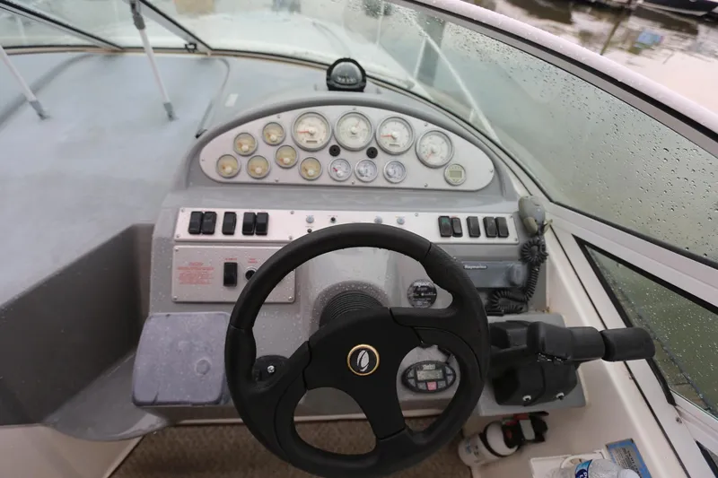 Slide: The Image of 2005 Cruisers Yachts 280 CXi Express helm with steering wheel and instrument panel. - 9