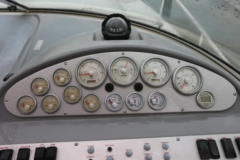 Slide: The Image of Dashboard of a 2005 Cruisers Yachts 280 CXi Express with gauges and controls. - 10