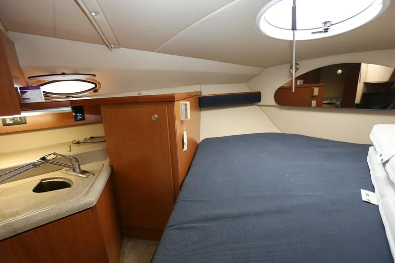 Slide: The Image of Interior cabin of 2005 Cruisers Yachts 280 CXi Express with bed and kitchenette. - 19