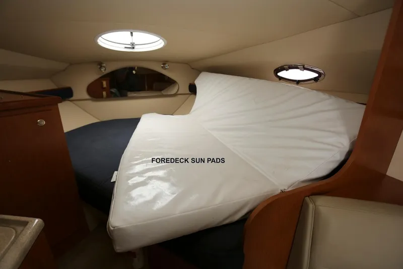 Slide: The Image of 2005 Cruisers Yachts 280 CXi Express cabin with foredeck sun pads. - 20