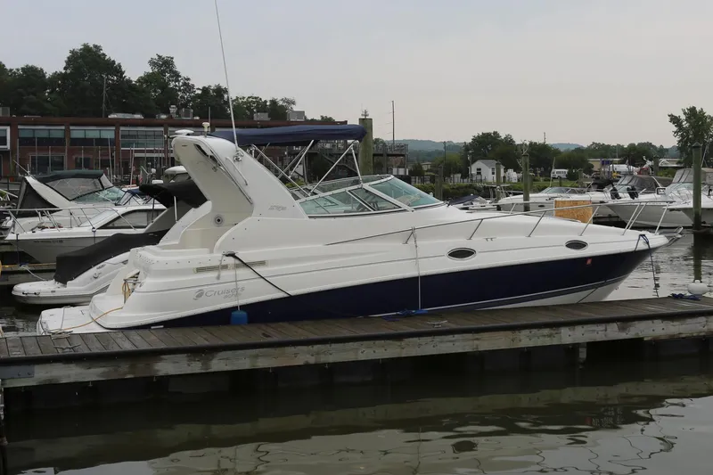 Slide: The Image of 2005 Cruisers Yachts 280 CXi Express docked at a marina. - 4