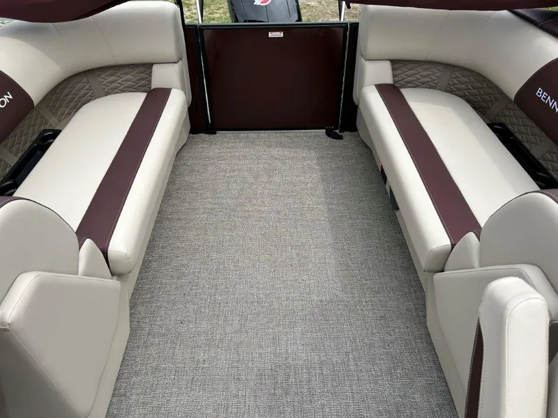 Slide: The Image of 2024 Bennington 22SSR boat interior with beige and brown seating. - 7