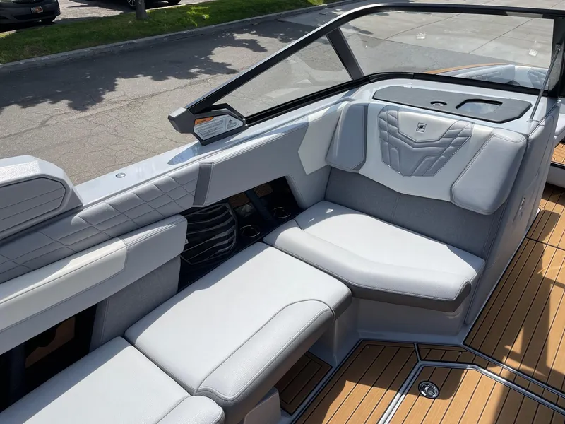 Slide: The Image of 2022 Nautique Super Air G23 boat interior with luxurious seating and modern design. - 10