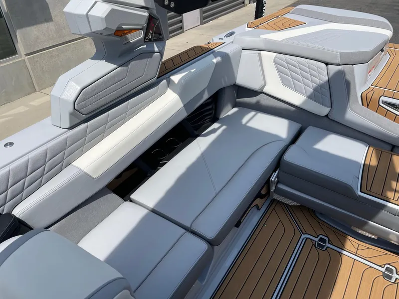 Slide: The Image of 2022 Nautique Super Air G23 boat interior with luxurious seating and modern design. - 7