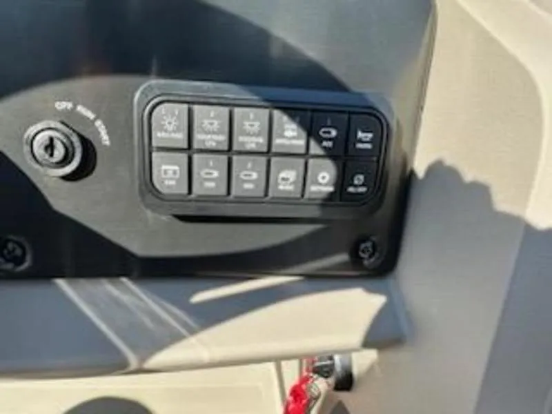 Slide: The Image of Control panel of 2024 Sun Tracker SF 20 DLX boat with various switches. - 13