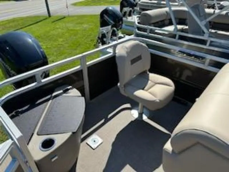 Slide: The Image of 2024 Sun Tracker SF 20 DLX pontoon boat interior with seating and storage. - 2