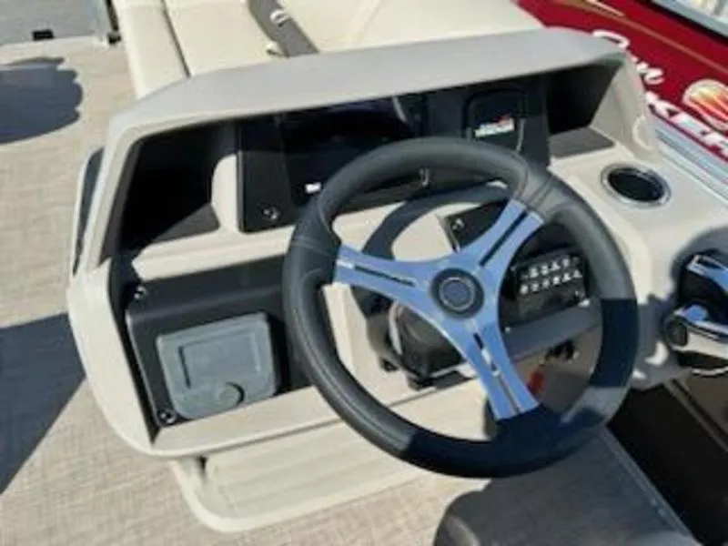 Slide: The Image of 2024 Sun Tracker SF 20 DLX steering console with modern controls and sleek design. - 3