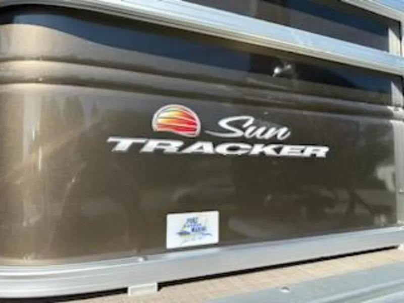 Slide: The Image of 2024 Sun Tracker SF 20 DLX logo on boat exterior. - 5