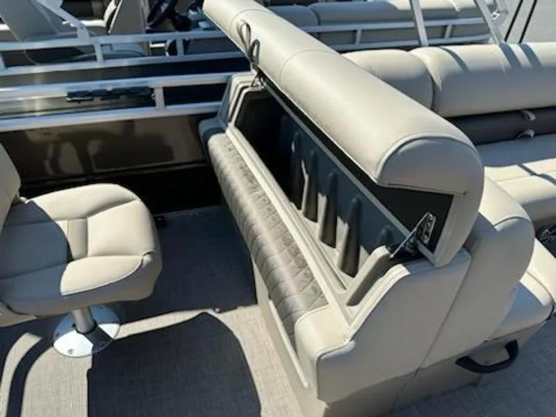 Slide: The Image of 2024 Sun Tracker SF 20 DLX boat interior with beige seating and storage compartment. - 7
