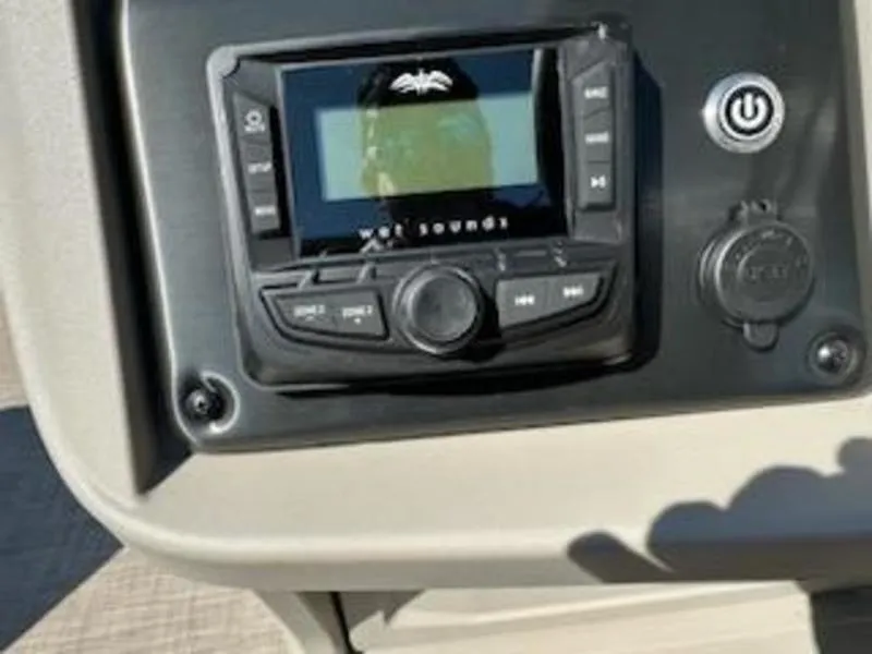 Slide: The Image of 2024 Sun Tracker SF 20 DLX boat stereo system with control panel. - 9