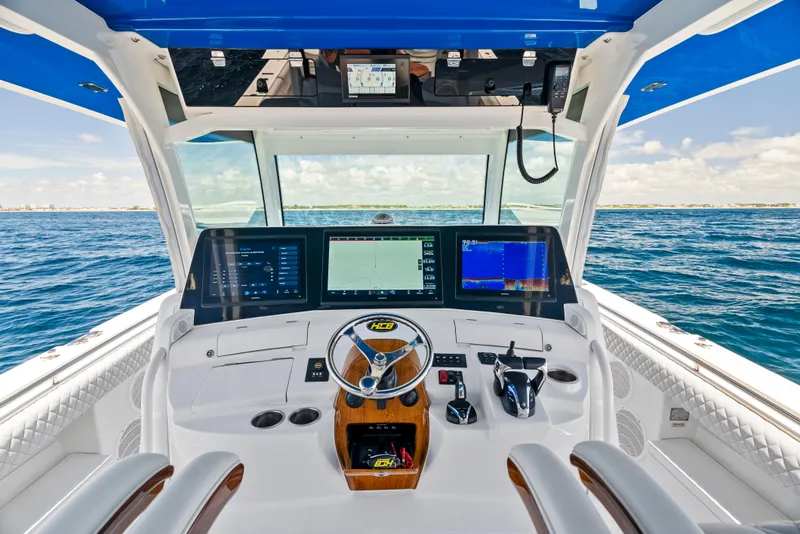 Slide: The Image of 2022 HCB Suenos boat cockpit with advanced navigation system and ocean view. - 19