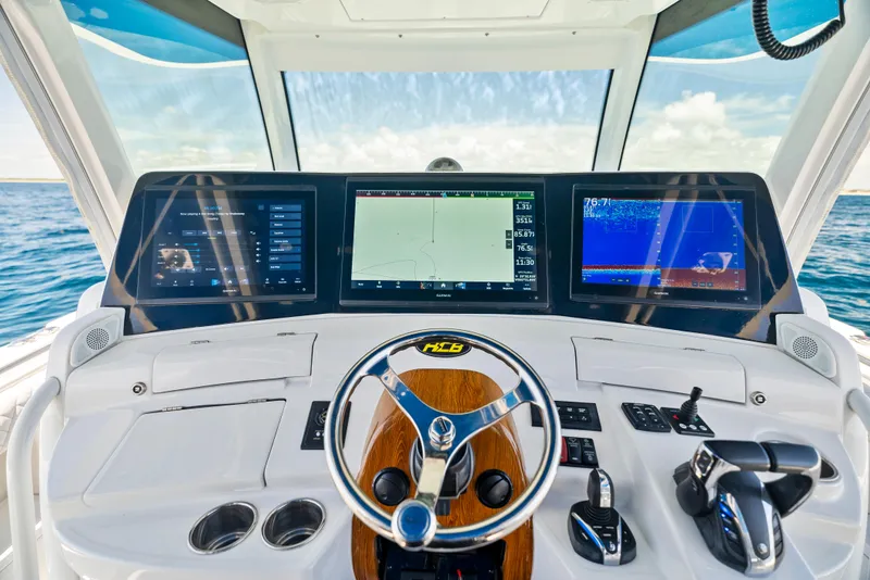 Slide: The Image of 2022 HCB Suenos boat dashboard with advanced navigation and control systems. - 24