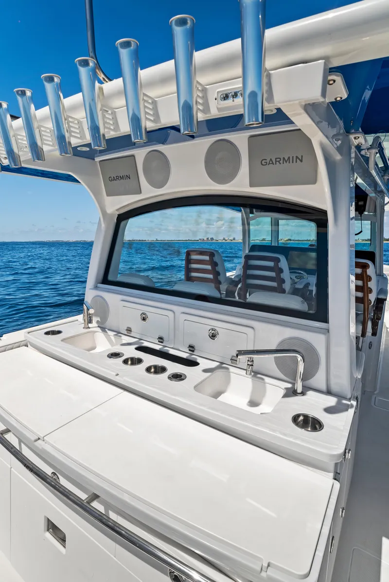 Slide: The Image of 2022 HCB Suenos boat with fishing rod holders and Garmin electronics on open sea. - 28