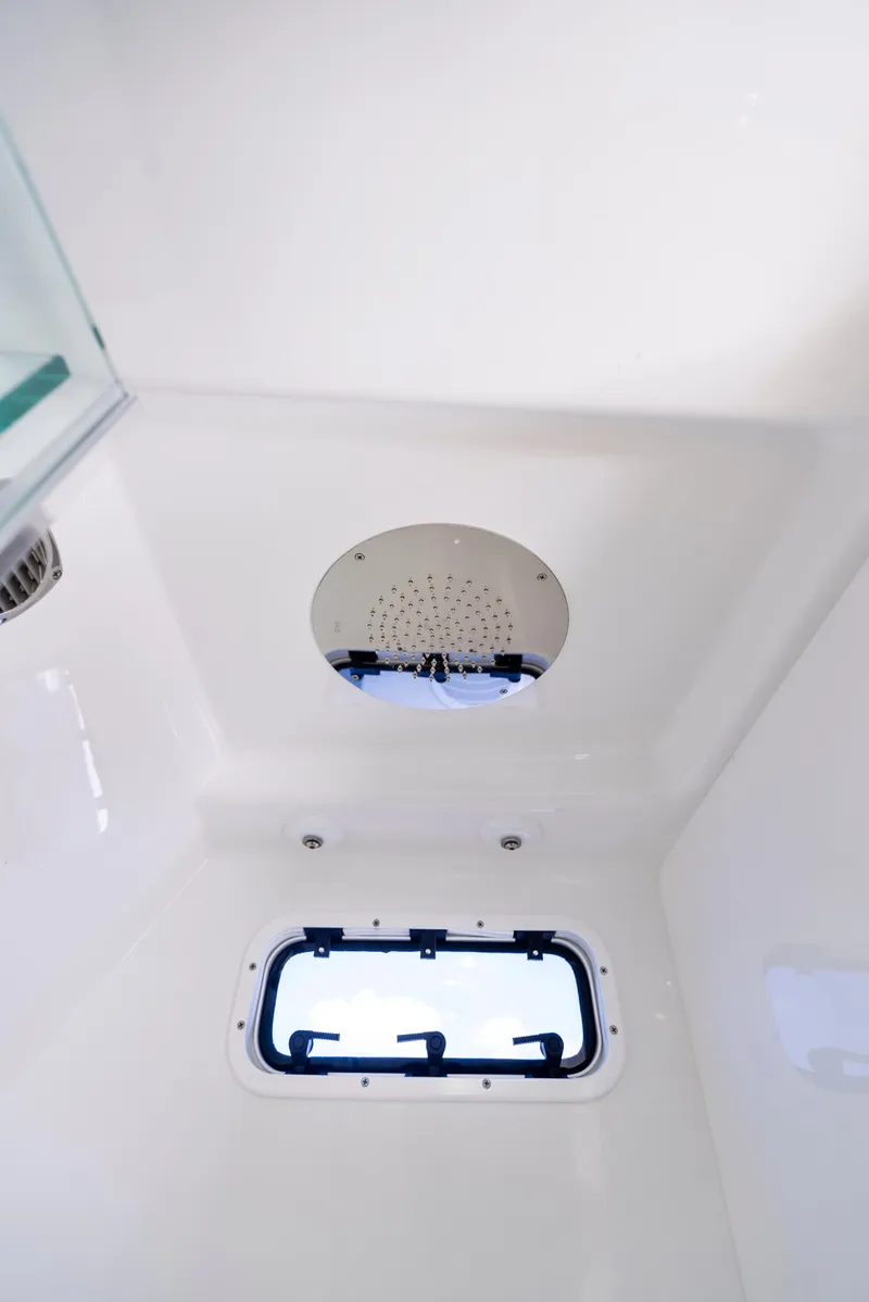 Slide: The Image of 2022 HCB Suenos boat interior shower with window and modern fixtures. - 45