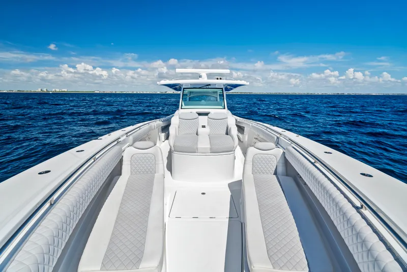 Slide: The Image of 2022 HCB Suenos boat on open sea under clear blue sky. - 8