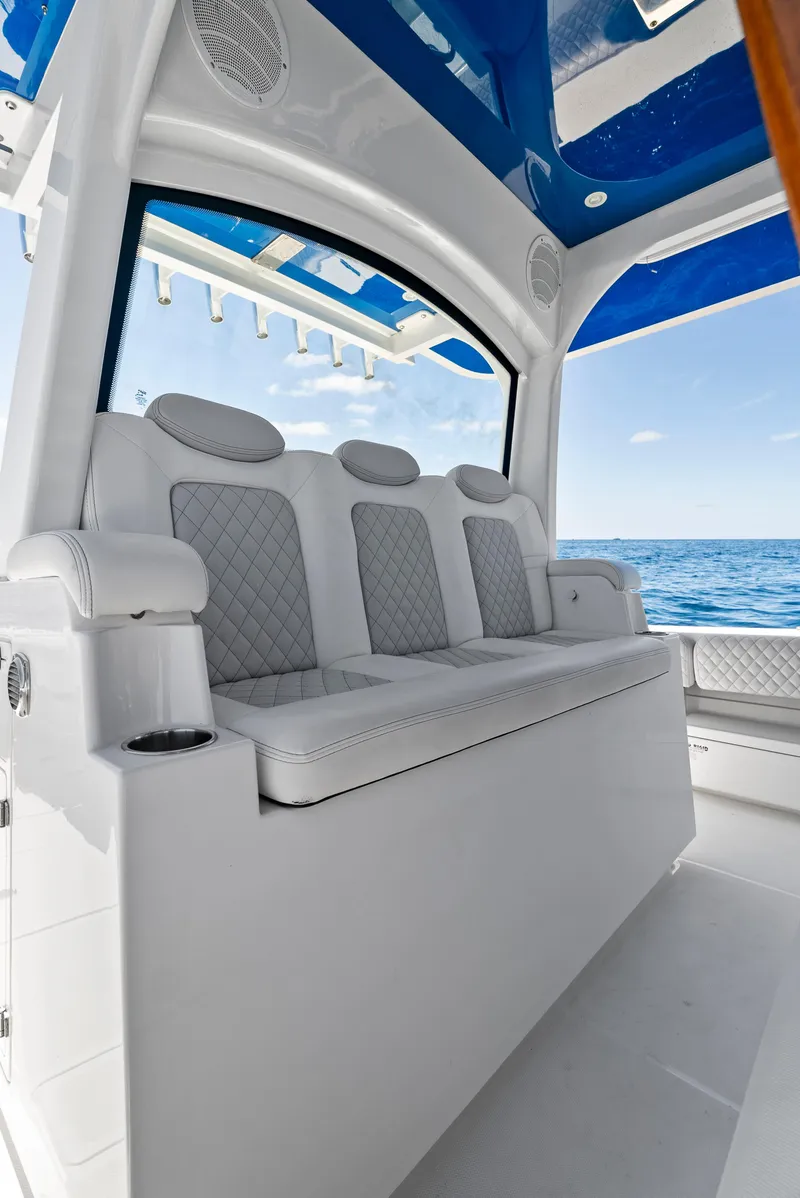 Slide: The Image of 2022 HCB Suenos boat interior with luxurious seating and ocean view. - 16