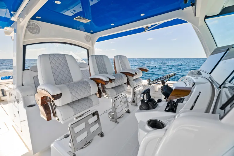 Slide: The Image of 2022 HCB Suenos boat interior with luxurious seating and ocean view. - 17