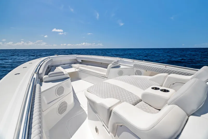 Slide: The Image of Luxurious 2022 HCB Suenos boat interior with plush seating on open ocean. - 3