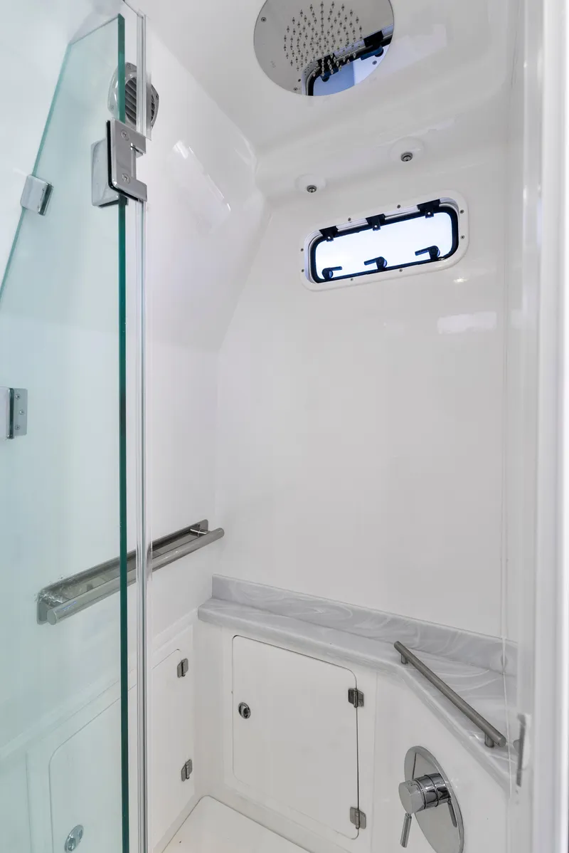 Slide: The Image of 2022 HCB Suenos boat shower with glass door and modern fixtures. - 43