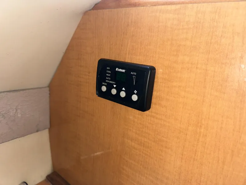 Slide: The Image of Control panel on 2011 Glastron GS 289 boat interior wooden wall. - 37